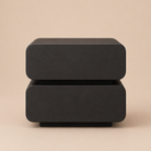 Black rectangular object on a beige background