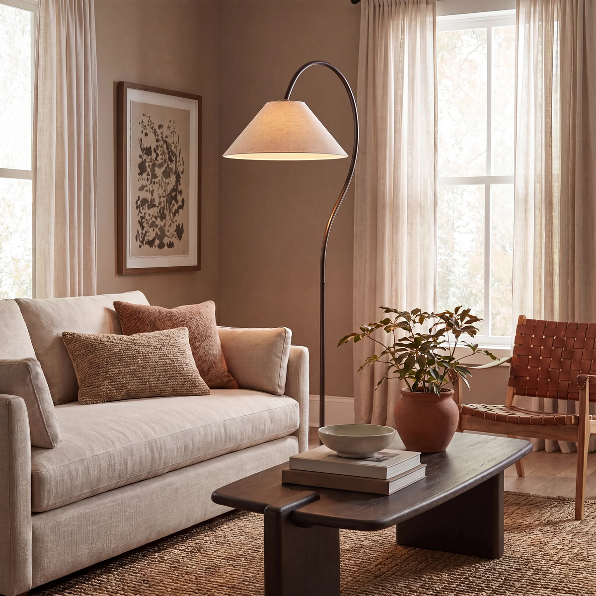 Vienne arc floor lamp styled beside a neutral sofa in a warm living room.
