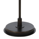 Close-up of the Vienne floor lamp's round dark antique bronze iron base.