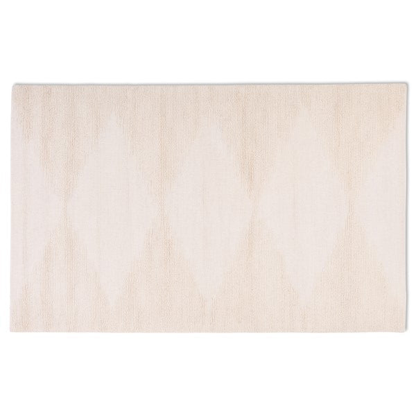 Full top-down view of the Vinne hand-tufted wool rug in ivory, featuring a subtle geometric diamond pattern