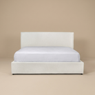 Full front view of the Vivienne upholstered platform bed in cream fabric featuring a modern low-profile design.