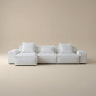 White sofa with cushions on a beige background