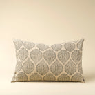Decorative pillow with leaf pattern on a beige background
