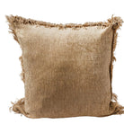 Textured brown pillow with frayed edges on a light gray background