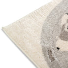 Close-up corner detail of the Zoomie Lane Kids Rug showing its soft ivory and grey pile.